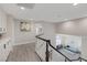 Second floor hallway offering a view down to the living room and access to the bedrooms at 1921 Spyglass Dr, Henderson, NV 89074