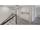 Upstairs hallway includes custom cabinets and access to additional bedrooms and storage at 1921 Spyglass Dr, Henderson, NV 89074