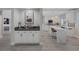 Open kitchen with quartz countertops and view to the bar with plenty of storage at 1921 Spyglass Dr, Henderson, NV 89074