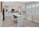 Modern kitchen featuring white cabinets, quartz countertops, and stainless steel appliances at 1921 Spyglass Dr, Henderson, NV 89074