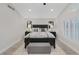 This main bedroom offers lots of natural light from the window and features a beautiful black bed frame at 1921 Spyglass Dr, Henderson, NV 89074