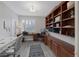 Dedicated office space with custom built-in shelves and cabinets providing ample storage at 1921 Spyglass Dr, Henderson, NV 89074