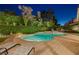 Relaxing backyard pool and spa area with lounge chairs for soaking up the sun at 1921 Spyglass Dr, Henderson, NV 89074