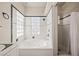 Bright bathroom featuring a jacuzzi tub with glass block windows and a separate shower with white tile at 1951 Jim Haworth Ct, Logandale, NV 89021