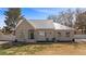 Charming single-story home featuring a metal roof, stucco exterior, and a well-maintained front yard at 1951 Jim Haworth Ct, Logandale, NV 89021