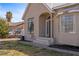 Charming single-story home featuring a metal roof, stucco exterior, and a well-maintained front yard at 1951 Jim Haworth Ct, Logandale, NV 89021