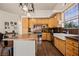 Well-lit kitchen featuring wooden cabinets, stainless steel appliances, and an island with bar seating at 1951 Jim Haworth Ct, Logandale, NV 89021