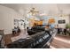 Spacious living room with a kitchen, hardwood floors, a ceiling fan, and ample natural light at 1951 Jim Haworth Ct, Logandale, NV 89021