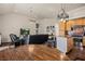 Open floor plan with eat in kitchen and living area with hardwood floors and overhead lighting at 1951 Jim Haworth Ct, Logandale, NV 89021