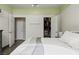The primary bedroom boasts an arch window, ceiling fan and en-suite bathroom at 1951 Jim Haworth Ct, Logandale, NV 89021