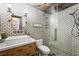 Modern bathroom featuring subway tile, glass shower, and vessel sink on a wood vanity at 211 Kokopelli Ct, Henderson, NV 89074