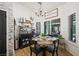 Cozy dining area with a coffee bar, natural light, and seating for four at 211 Kokopelli Ct, Henderson, NV 89074