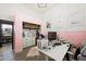 Cozy office space with pink walls, white furniture, closet and a glimpse of the bathroom at 211 Kokopelli Ct, Henderson, NV 89074