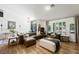 Cozy living room featuring stylish sofas, neutral decor, and bright natural light at 211 Kokopelli Ct, Henderson, NV 89074
