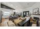 Open concept living area with kitchen, dining area, fireplace, and views to the backyard at 211 Kokopelli Ct, Henderson, NV 89074