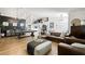 Elegant living room with stylish seating, a modern pool table, and ample space for entertaining at 211 Kokopelli Ct, Henderson, NV 89074