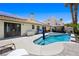Relaxing pool area with solar panels, a gazebo and covered outdoor seating area at 211 Kokopelli Ct, Henderson, NV 89074