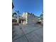 Spacious backyard with low-maintenance landscaping with a small upper balcony and extended concrete patio at 2306 Jared Ct, North Las Vegas, NV 89032