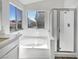 Bright bathroom showcasing a soaking tub and a walk-in shower at 2306 Jared Ct, North Las Vegas, NV 89032