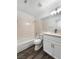 Modern bathroom featuring wood-look floors, bathtub, and vanity with sink at 2306 Jared Ct, North Las Vegas, NV 89032