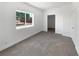Bright bedroom with a large window and neutral carpet at 2306 Jared Ct, North Las Vegas, NV 89032