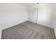 Simple bedroom featuring plush carpet, a closet, and white walls at 2306 Jared Ct, North Las Vegas, NV 89032