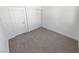 Cozy bedroom features neutral carpet, white walls and closet with sliding doors at 2306 Jared Ct, North Las Vegas, NV 89032