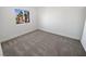 A clean and simple bedroom with ample light and neutral carpet at 2306 Jared Ct, North Las Vegas, NV 89032