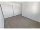 Simple bedroom featuring plush carpet, a closet, and white walls at 2306 Jared Ct, North Las Vegas, NV 89032