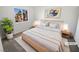 Cozy bedroom with natural light, neutral colors, and minimalist decor for relaxation at 2306 Jared Ct, North Las Vegas, NV 89032