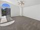 Bright bedroom featuring plush carpet, a ceiling fan, and sliding glass doors to a balcony at 2306 Jared Ct, North Las Vegas, NV 89032
