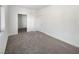 Bedroom featuring neutral carpet and a closet with folding doors at 2306 Jared Ct, North Las Vegas, NV 89032