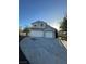 Charming two-story home with a two-car garage, extended driveway, and well-maintained landscaping at 2306 Jared Ct, North Las Vegas, NV 89032