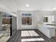 Eat in kitchen featuring bright light, island seating and vinyl flooring at 2306 Jared Ct, North Las Vegas, NV 89032