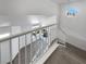 View from top of the staircase down to the living area with lots of natural light at 2306 Jared Ct, North Las Vegas, NV 89032