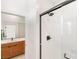 Bathroom featuring a tiled shower with a sleek black frame at 2578 Skylark Trail St, Henderson, NV 89044