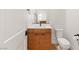 Half bathroom featuring modern fixtures and a white countertop and toilet at 2578 Skylark Trail St, Henderson, NV 89044