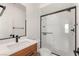 Modern bathroom with a glass-enclosed shower and stylish vanity at 2578 Skylark Trail St, Henderson, NV 89044