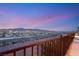 Scenic view of city and mountain skyline from balcony at sunset under colorful sky at 2578 Skylark Trail St, Henderson, NV 89044