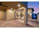 Relaxing covered patio with brick flooring, outdoor lights and comfortable lounge furniture at 2578 Skylark Trail St, Henderson, NV 89044