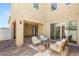 Inviting covered patio with outdoor seating, perfect for relaxing and entertaining guests at 2578 Skylark Trail St, Henderson, NV 89044