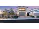 Contemporary two-story home featuring a spacious garage, sleek design, landscaped front yard, and a private balcony at 2578 Skylark Trail St, Henderson, NV 89044
