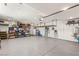 Spacious garage features epoxy flooring, shelving, and ample storage solutions at 2578 Skylark Trail St, Henderson, NV 89044