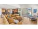 Open living area with kitchen view and access to the pool area at 2578 Skylark Trail St, Henderson, NV 89044