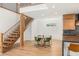Open living space featuring a modern staircase and a view of the dining area and kitchen at 2578 Skylark Trail St, Henderson, NV 89044