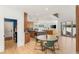 Open-concept living space with kitchen, dining area, and living room, featuring a sliding glass door to the outside at 2578 Skylark Trail St, Henderson, NV 89044