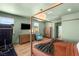 Bedroom with a four-poster bed, an exercise machine, and modern decor at 2578 Skylark Trail St, Henderson, NV 89044