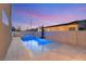 Sparkling pool and spa area with a contemporary design and privacy wall at 2578 Skylark Trail St, Henderson, NV 89044