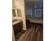 Bedroom next to a vanity area featuring essential amenities and a comfortable bed at 2606 S Durango Dr # 214, Las Vegas, NV 89117