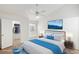 Staged bedroom features a ceiling fan, carpet, window seat, and closet access at 2725 S Nellis Blvd # 2049, Las Vegas, NV 89121